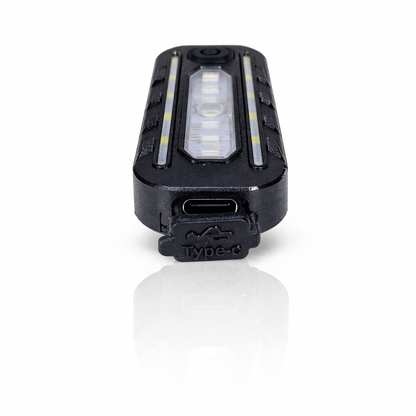 Éclairage vélo LED rechargeable USB-C multifonction noir à clips vue socle de chargement
